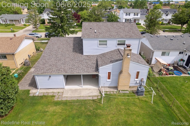 42127 Addison Ave, Canton, MI 48187 - rear view of property featuring a residential view, roof with shingles, a patio, and central AC