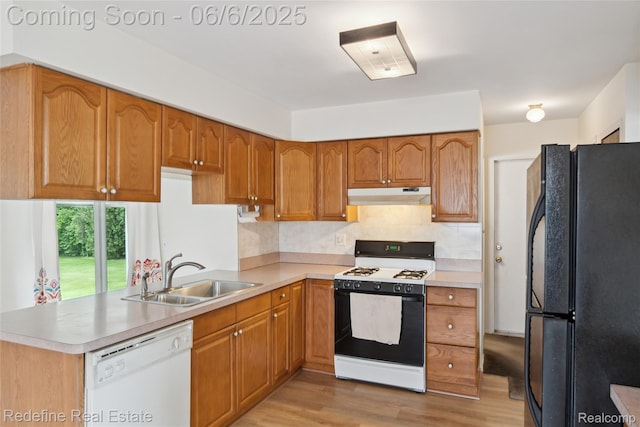 42127 Addison Ave, Canton, MI 48187 - kitchen with freestanding refrigerator, dishwasher, range with gas cooktop, a sink, and under cabinet range hood