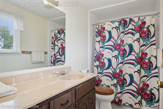 42127 Addison Ave, Canton, MI 48187 - full bath featuring vanity, toilet, and a shower with shower curtain