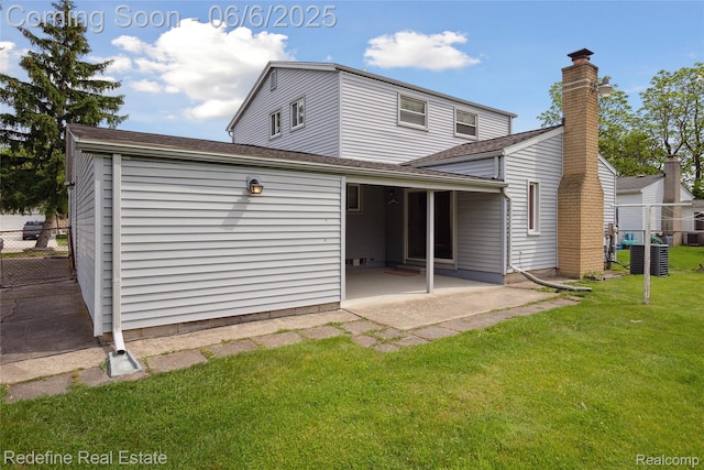 42127 Addison Ave, Canton, MI 48187 - rear view of property with a patio area, a chimney, and central AC unit