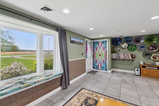 foyer with a wealth of natural light, visible vents, and recessed lighting