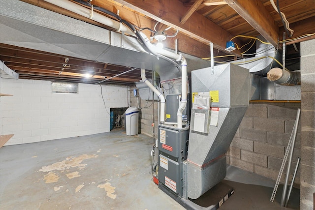 unfinished basement featuring heating unit