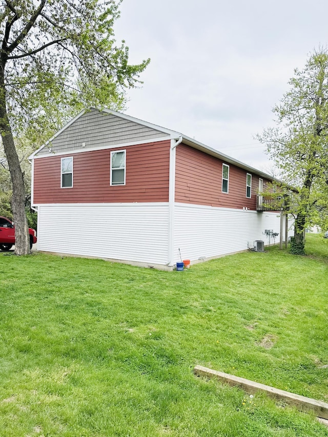 1312 Lafayette Ave, Kalamazoo, MI 49006 - view of side of home with a lawn and central AC