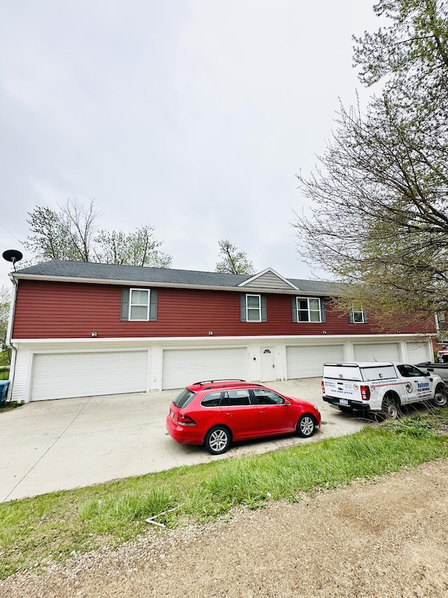 1312 Lafayette Ave, Kalamazoo, MI 49006 - view of front of house featuring driveway and a garage