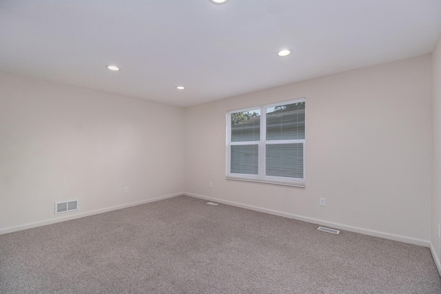 1312 Lafayette Ave, Kalamazoo, MI 49006 - carpeted empty room with baseboards, recessed lighting, and visible vents