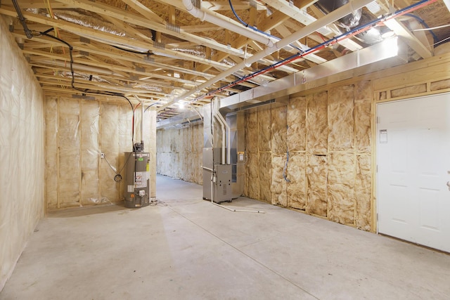 1312 Lafayette Ave, Kalamazoo, MI 49006 - unfinished basement featuring gas water heater and heating unit