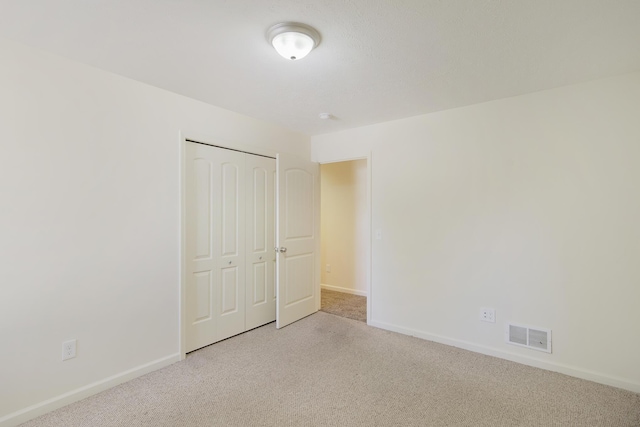 1312 Lafayette Ave, Kalamazoo, MI 49006 - unfurnished bedroom featuring a closet, visible vents, and baseboards