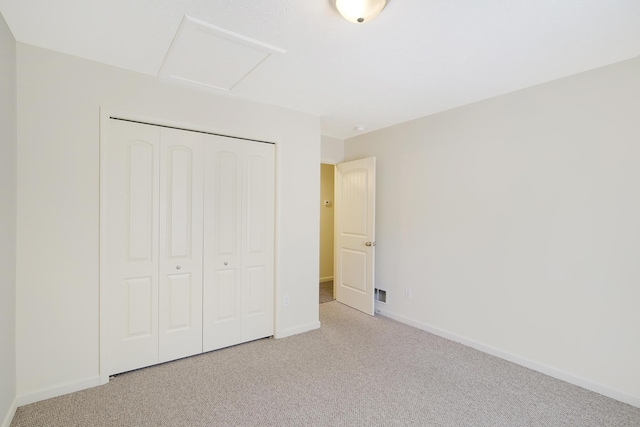 1312 Lafayette Ave, Kalamazoo, MI 49006 - unfurnished bedroom with carpet flooring, a closet, visible vents, and baseboards