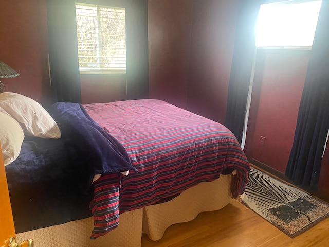 bedroom featuring wood finished floors