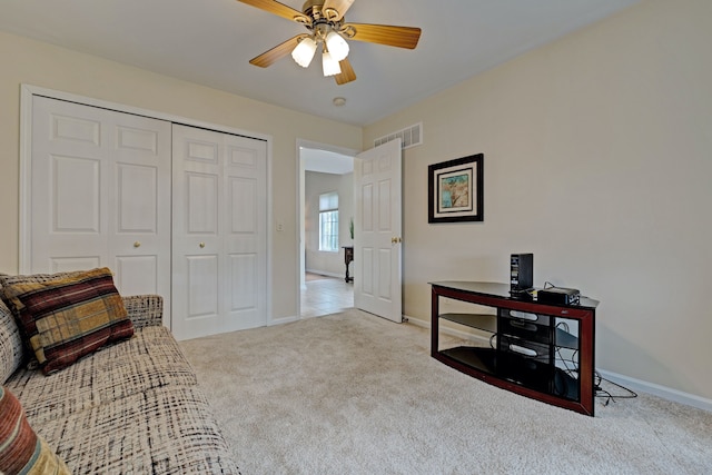 sitting room featuring ceiling fan, carpet, baseboards, and visible vents