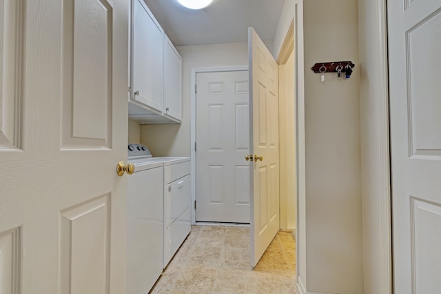 laundry area featuring cabinet space and independent washer and dryer