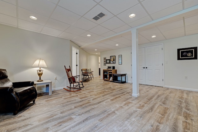 sitting room with baseboards, recessed lighting, visible vents, and wood finished floors
