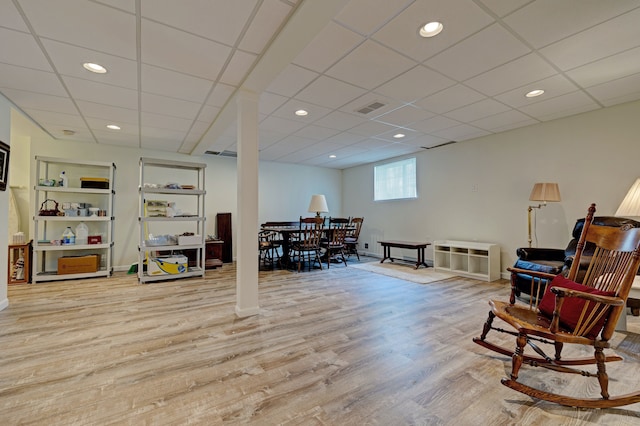 interior space featuring a drop ceiling, wood finished floors, visible vents, baseboards, and recessed lighting