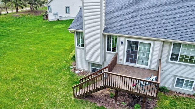 wooden deck with a yard and stairs