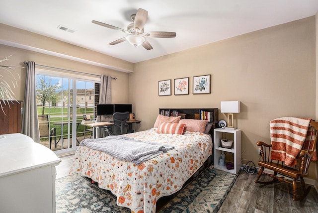 bedroom with ceiling fan, access to outside, visible vents, and wood finished floors