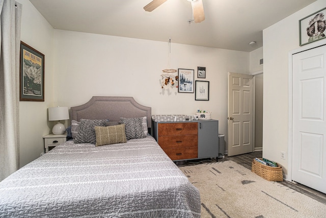 bedroom with wood finished floors and a ceiling fan