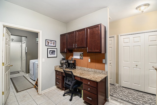 office space with separate washer and dryer, light tile patterned floors, and baseboards