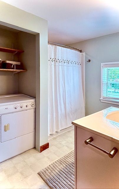 interior space featuring washer / clothes dryer and light floors