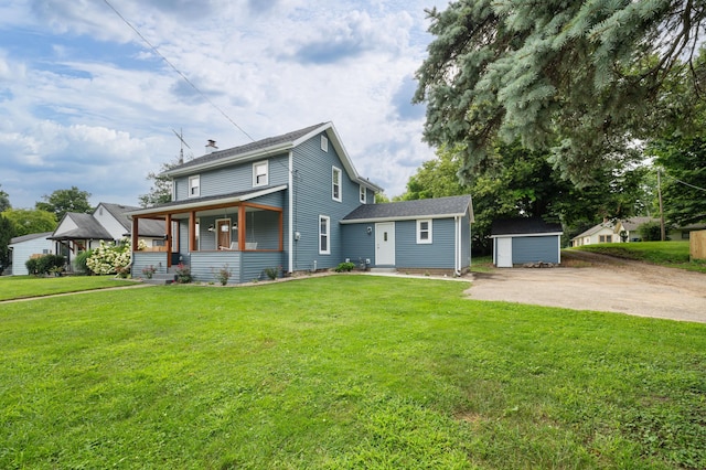 back of property featuring covered porch, a storage shed, a chimney, a lawn, and an outdoor structure