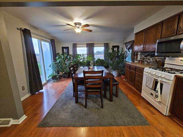 3544 Burnsline Rd, Brown City, MI 48416 - dining space featuring ceiling fan, baseboards, visible vents, and wood finished floors
