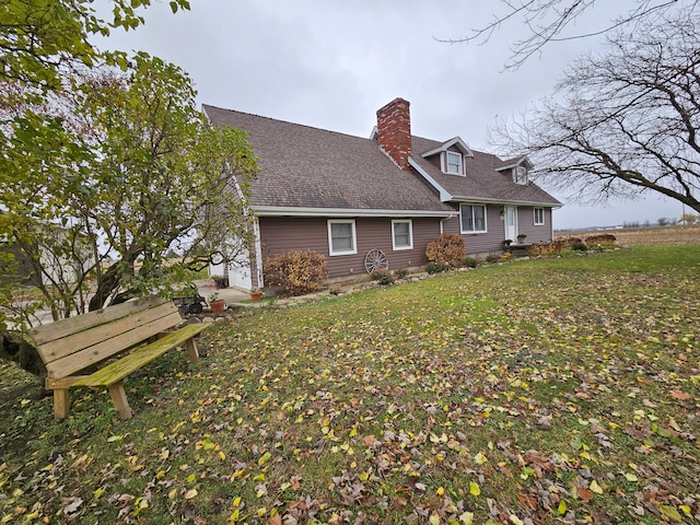 3544 Burnsline Rd, Brown City, MI 48416 - rear view of property with roof with shingles and a chimney