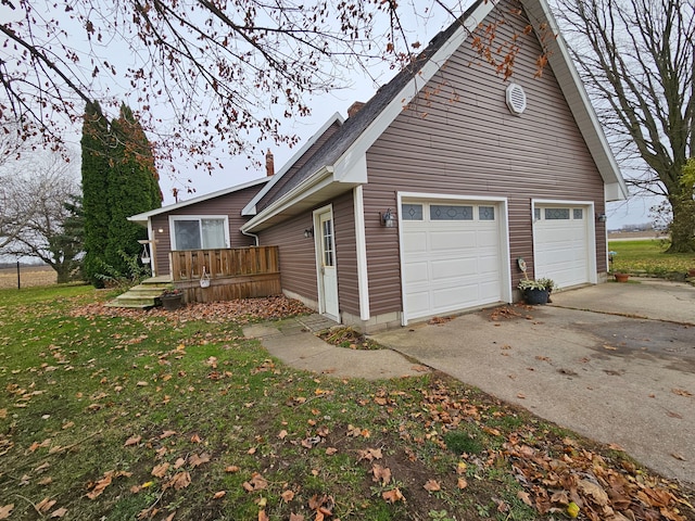 3544 Burnsline Rd, Brown City, MI 48416 - view of property exterior with concrete driveway, a yard, and a chimney