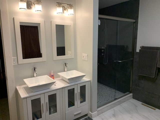 3544 Burnsline Rd, Brown City, MI 48416 - bathroom featuring double vanity, marble finish floor, a shower stall, and a sink
