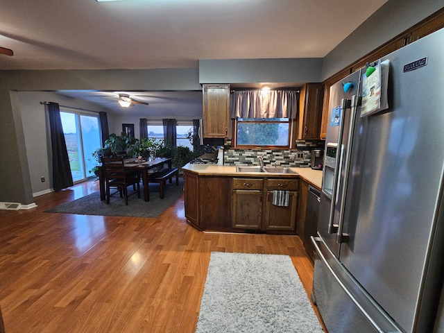 3544 Burnsline Rd, Brown City, MI 48416 - kitchen with light countertops, high end fridge, ceiling fan, and a sink