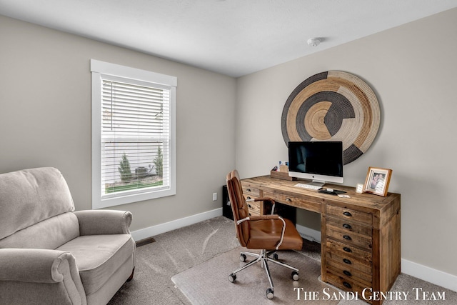 carpeted home office with visible vents and baseboards