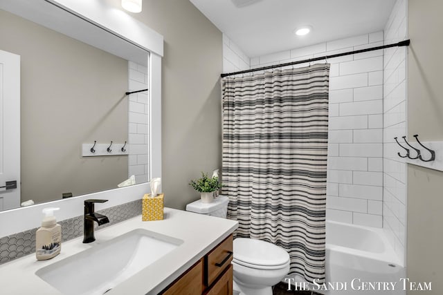 bathroom with vanity, toilet, shower / bathtub combination with curtain, and recessed lighting