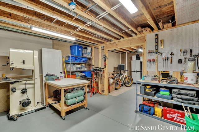 unfinished below grade area featuring a workshop area
