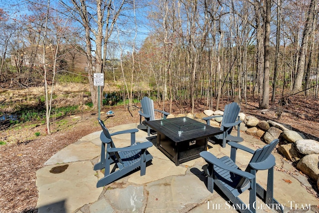 view of patio featuring a fire pit