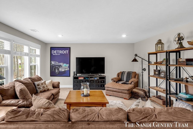 carpeted living room with baseboards, visible vents, and recessed lighting