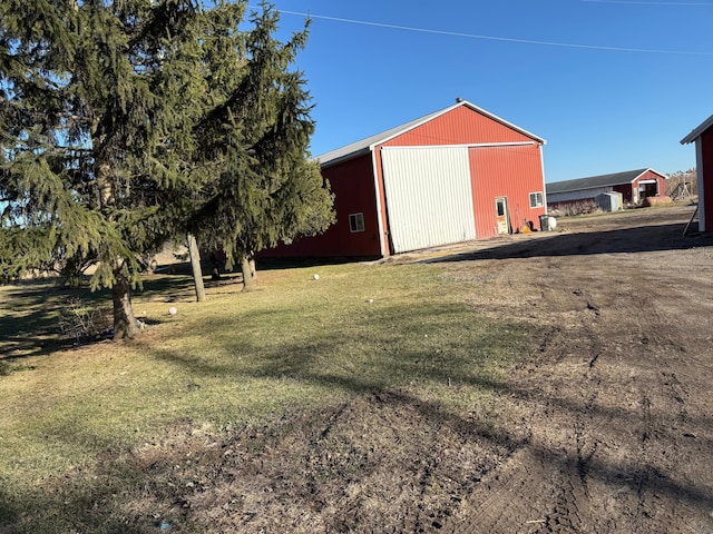 4131 Wellman Line Rd, Brown City, MI 48416 - view of pole building featuring a lawn and dirt driveway