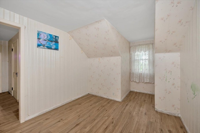 4131 Wellman Line Rd, Brown City, MI 48416 - additional living space featuring wood finished floors, wallpapered walls, and baseboards