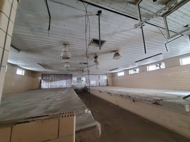 4131 Wellman Line Rd, Brown City, MI 48416 - misc room with concrete floors, healthy amount of natural light, and a garage