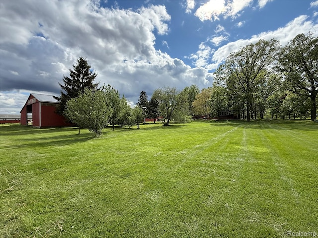 4131 Wellman Line Rd, Brown City, MI 48416 - view of green lawn with an outbuilding