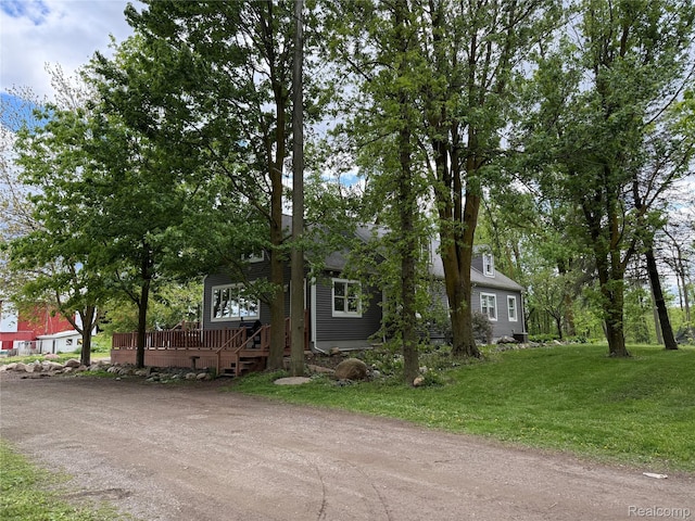 4131 Wellman Line Rd, Brown City, MI 48416 - obstructed view of property with a front lawn and a deck