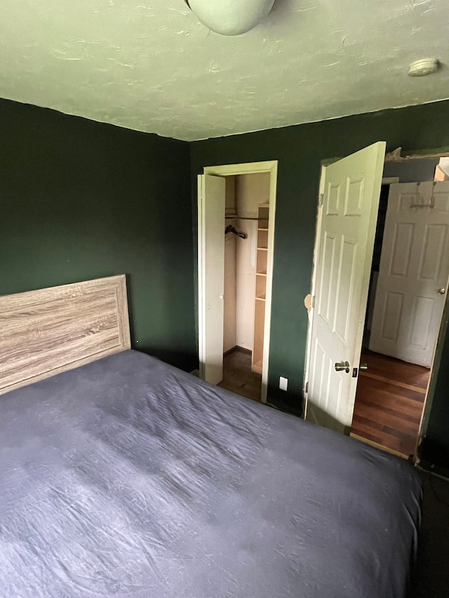 carpeted bedroom with a closet
