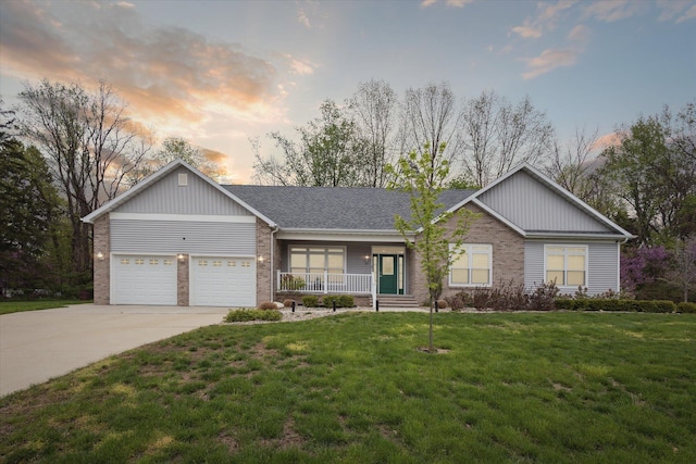 ranch-style house with a porch, an attached garage, brick siding, concrete driveway, and a front yard