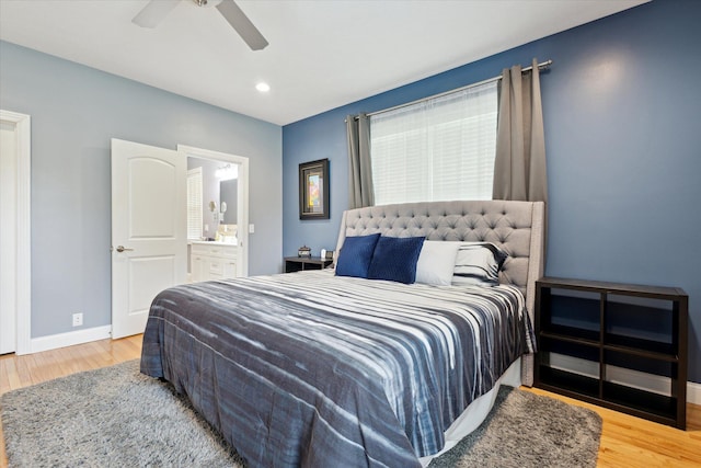 bedroom with connected bathroom, wood finished floors, a ceiling fan, baseboards, and recessed lighting