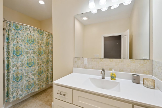 full bathroom with vanity, backsplash, and tile patterned flooring