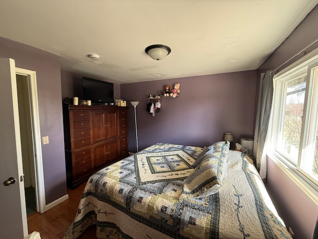 15183 Yale Rd, Lynn, MI 48097 - bedroom featuring baseboards and dark wood-type flooring