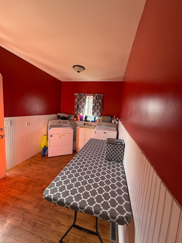 15183 Yale Rd, Lynn, MI 48097 - laundry room featuring washing machine and dryer, wood finished floors, laundry area, a wainscoted wall, and visible vents