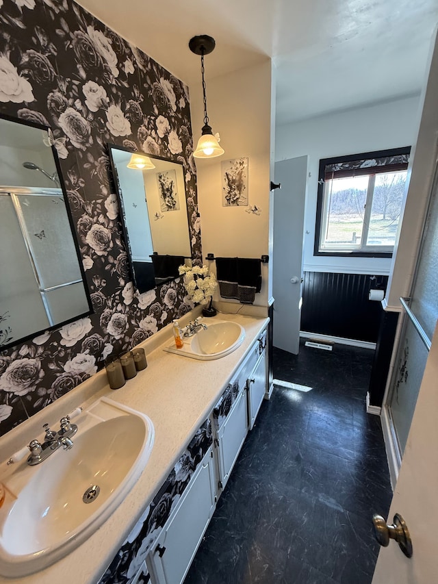 15183 Yale Rd, Lynn, MI 48097 - full bath with double vanity, wallpapered walls, a shower with shower door, and a sink