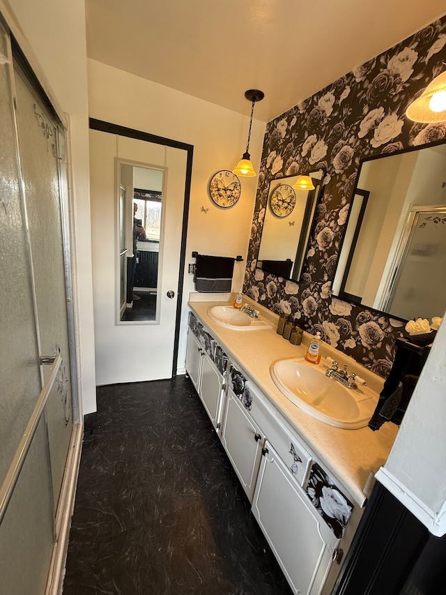 15183 Yale Rd, Lynn, MI 48097 - bathroom featuring a shower with shower door, wallpapered walls, double vanity, and a sink