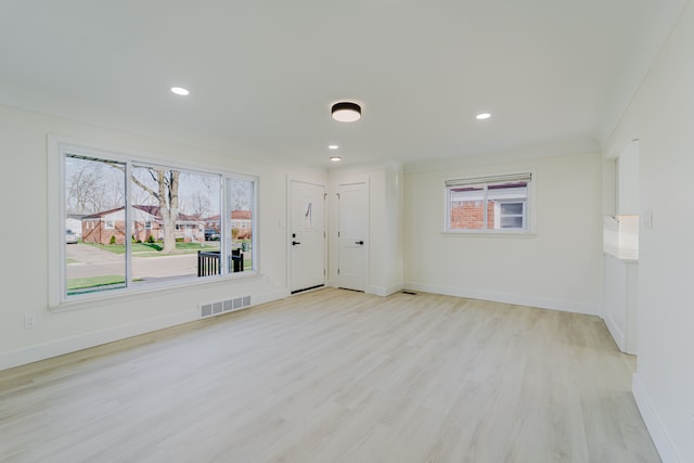 interior space with recessed lighting, baseboards, visible vents, and light wood-style floors