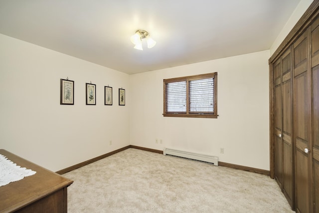 unfurnished bedroom featuring light carpet, baseboards, a closet, and baseboard heating