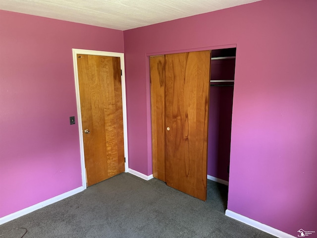 8367 S Douglas Rd, Bedford, MI 48144 - unfurnished bedroom with baseboards, a closet, and carpet