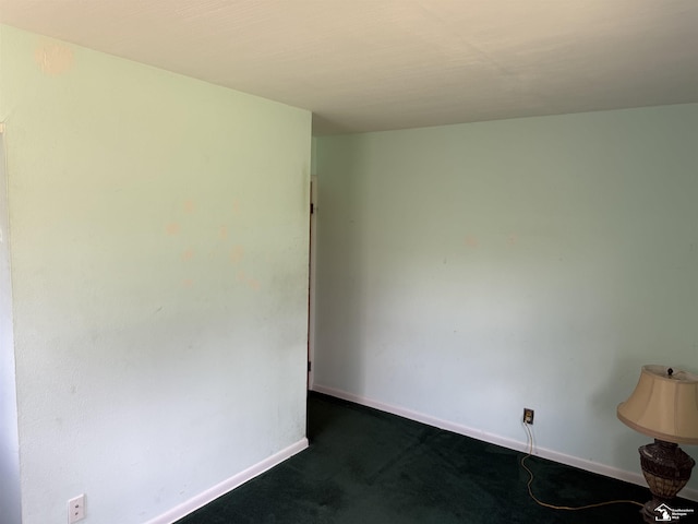 8367 S Douglas Rd, Bedford, MI 48144 - unfurnished room featuring baseboards and dark colored carpet